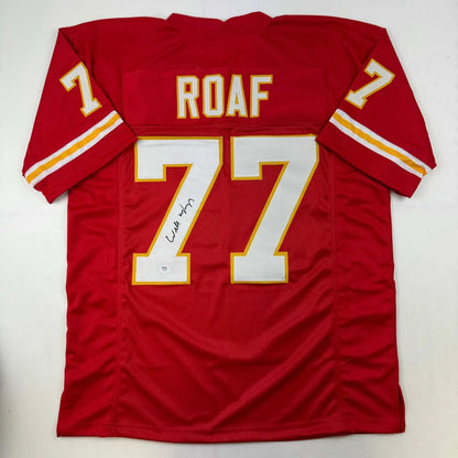 Red custom jersey with ROAF 77 autograph, perfect for professional sports fans