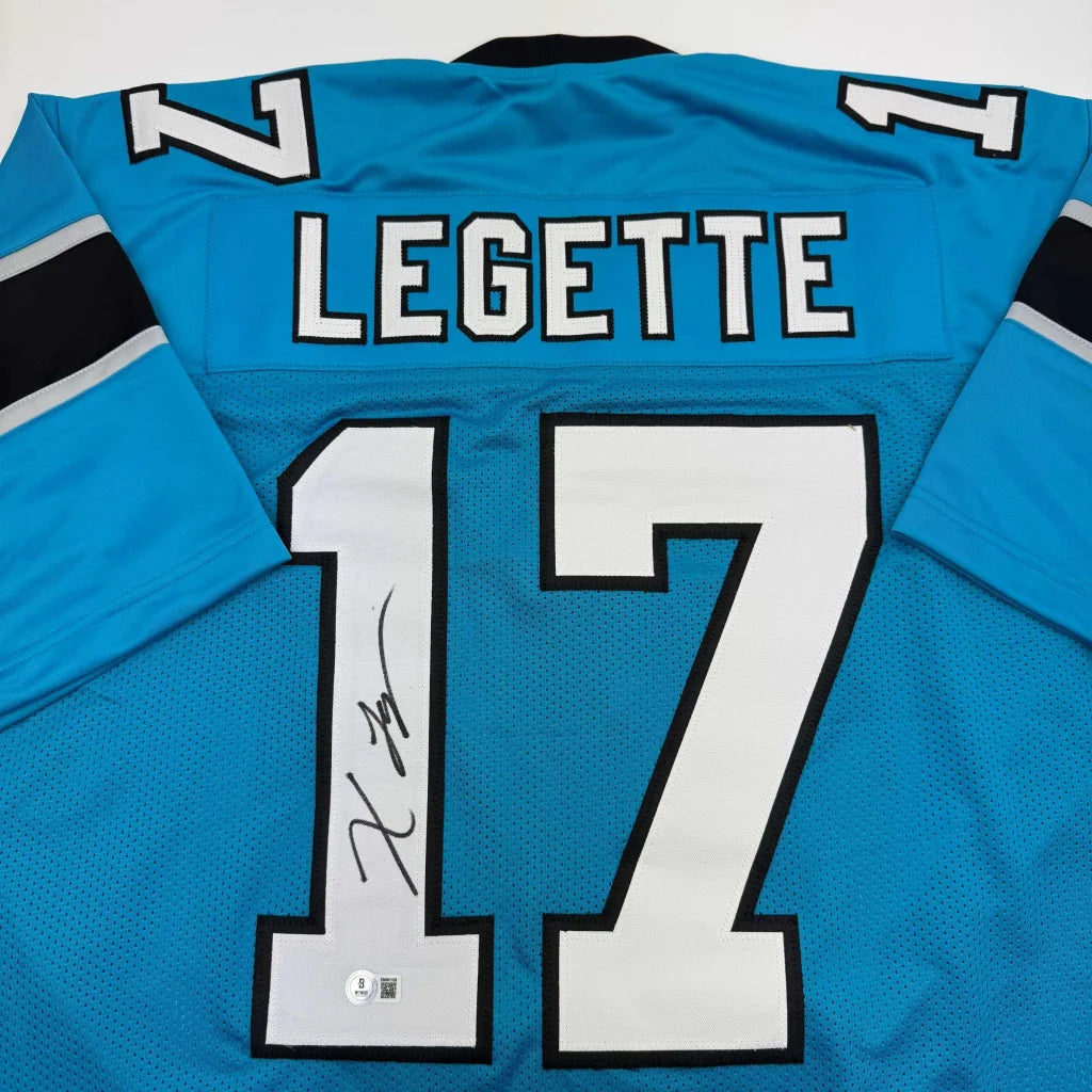 Back side of a vibrant blue custom carolina panthers football jersey featuring professional sports league autograph legette 17