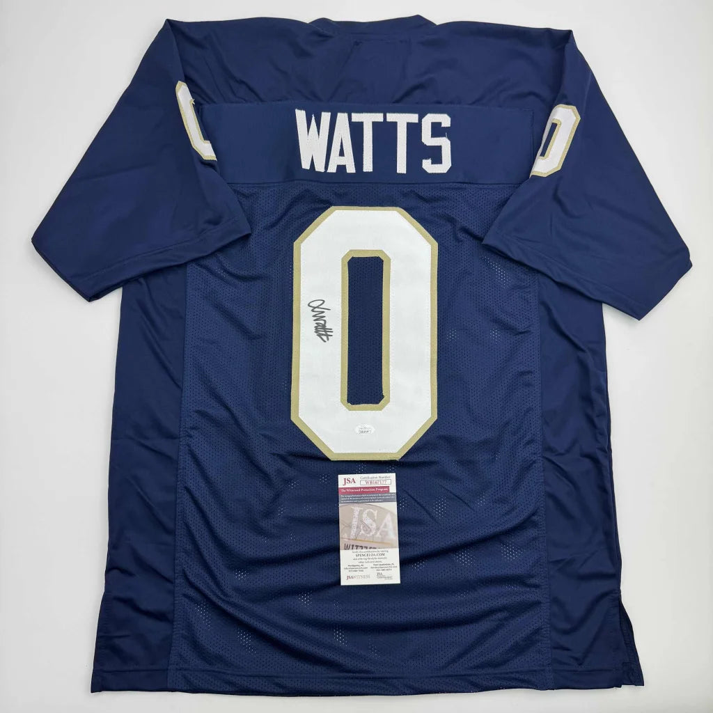 Back of a navy blue custom jersey featuring white and gold number 0 and autographed name watts from professional sports league