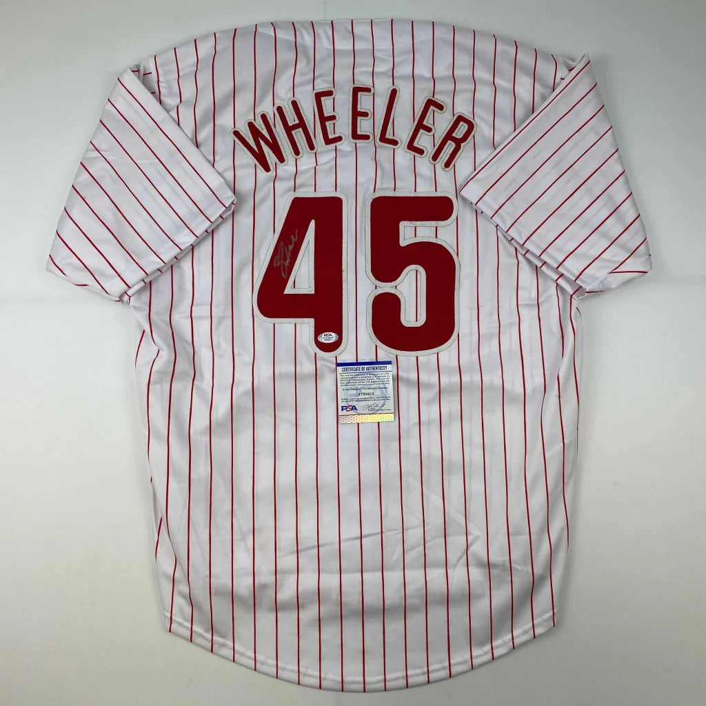 White Wheeler professional sports league jersey with red pinstripes and authentic sticker