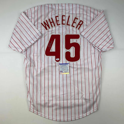 White Wheeler professional sports league jersey with red pinstripes and authentic sticker