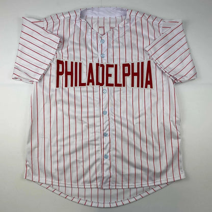 White baseball jersey with red pinstripes and PHILADELPHIA for professional sports league fans