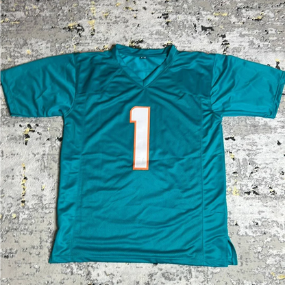 Teal Miami Dolphins jersey with autographed Tua Tagovailoa and number 1 in white with orange outline