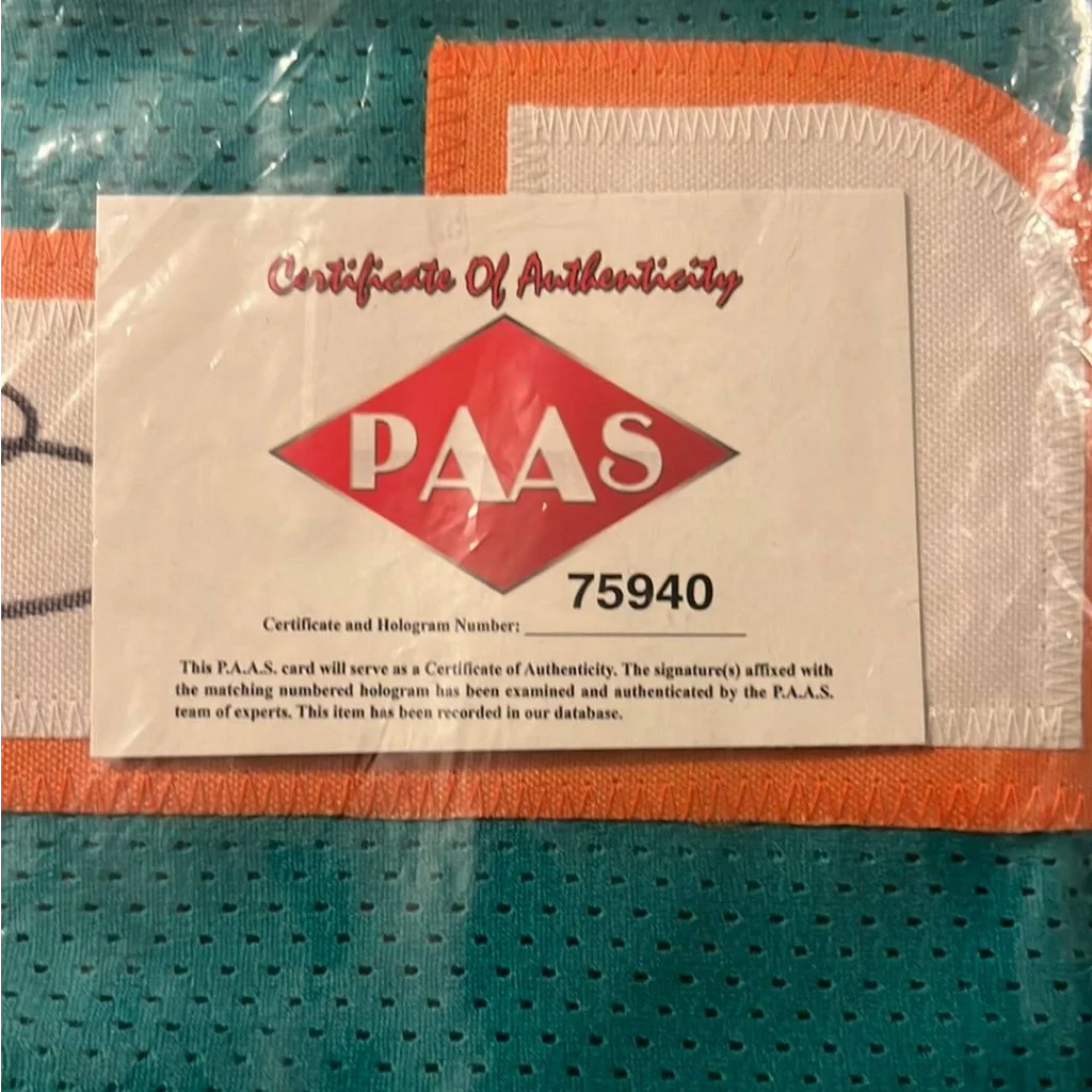 Certificate of Authenticity with PAAS logo and hologram number 75940 for autographed Tua Tagovailoa Miami Dolphins jersey