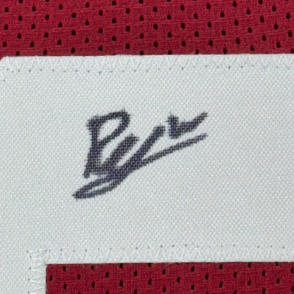 Red football jersey with white tag and black embroidered signature for Man Cave decor