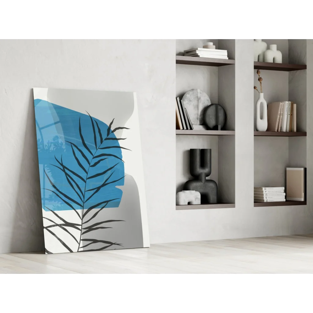 Bold blue palm frond glass wall art with black silhouette on white background