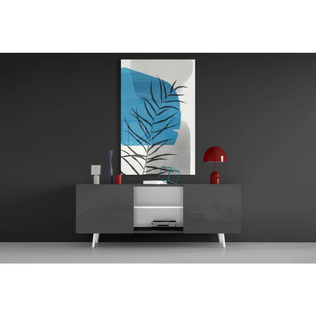 Bold blue palm frond glass wall art with black silhouette on white canvas