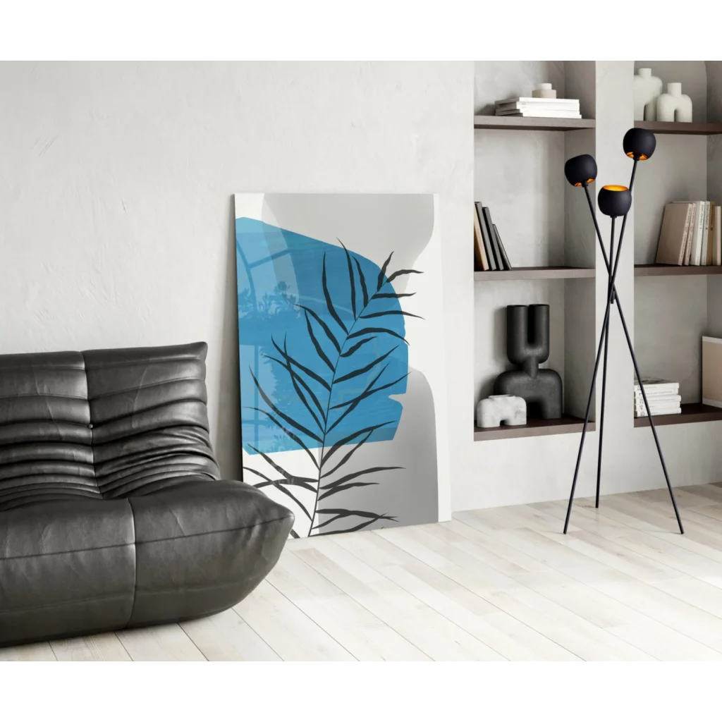 Modern bold blue palm frond glass wall art with black silhouette splash