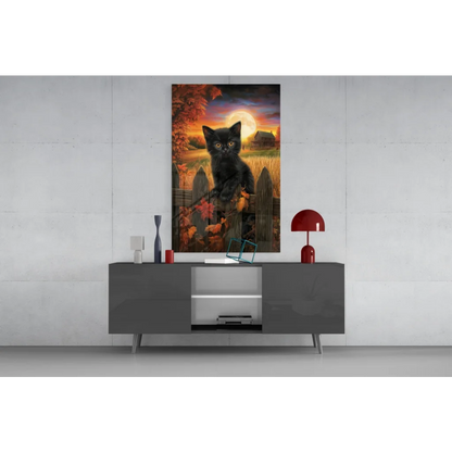 Black cat with glowing yellow eyes on fence, autumn glass wall art print