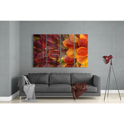 Vibrant autumn leaf glass wall art triptych in modern living room