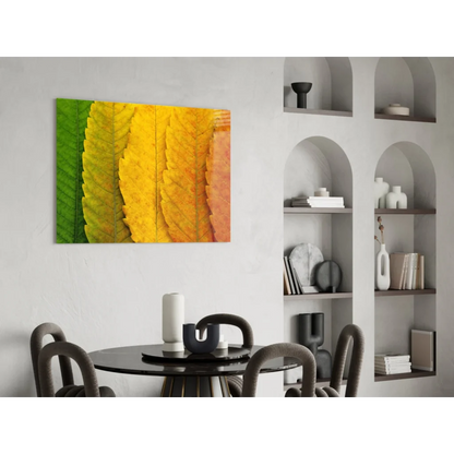 Vibrant autumn leaves glass wall art in green yellow orange hues