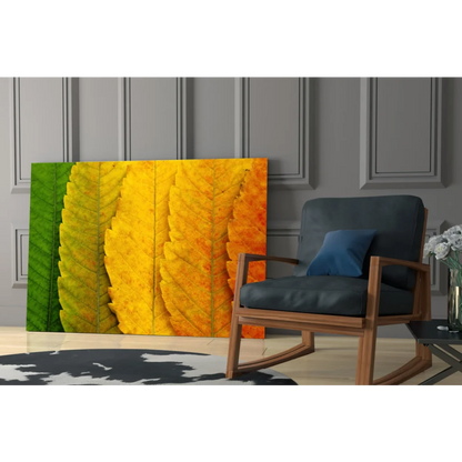 Autumn leaves canvas wall art in green yellow orange on gray wall