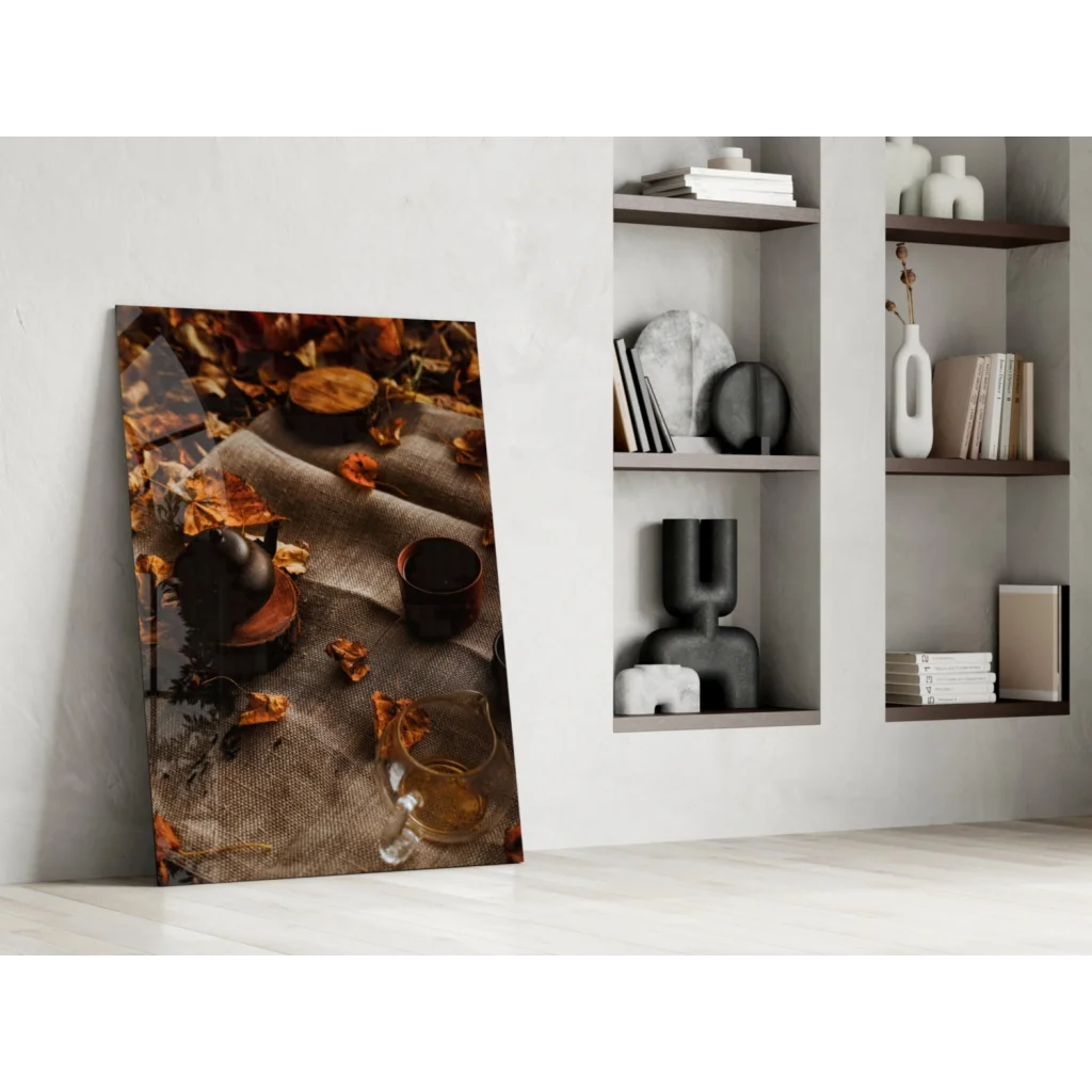Cozy autumn tea scene canvas wall art with leaves and glassware