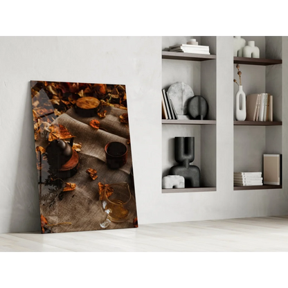 Cozy autumn tea scene canvas wall art with leaves and glassware