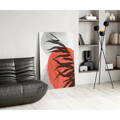 Bold orange and black tropical leaf glass wall art on white canvas background