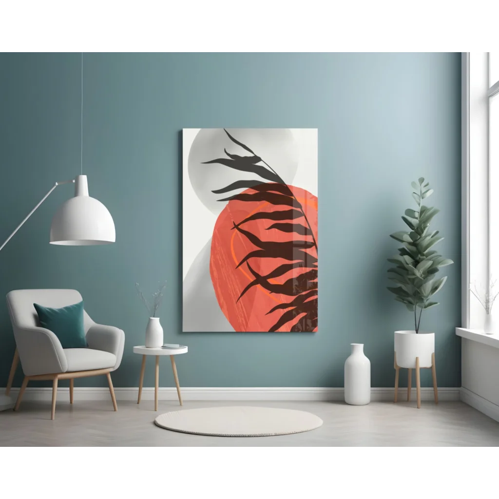 Bold black leaf silhouettes on vibrant orange glass wall art