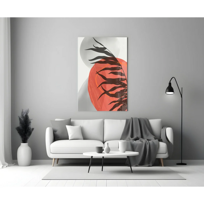 Bold orange and black tropical leaf glass wall art on white background