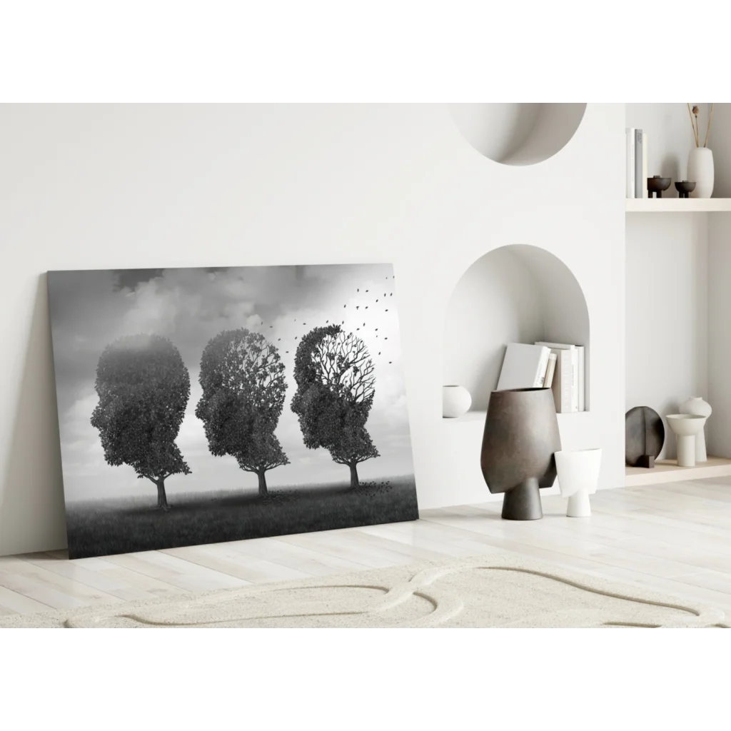 Black and white canvas wall art print of three tree human heads leaning on white wall