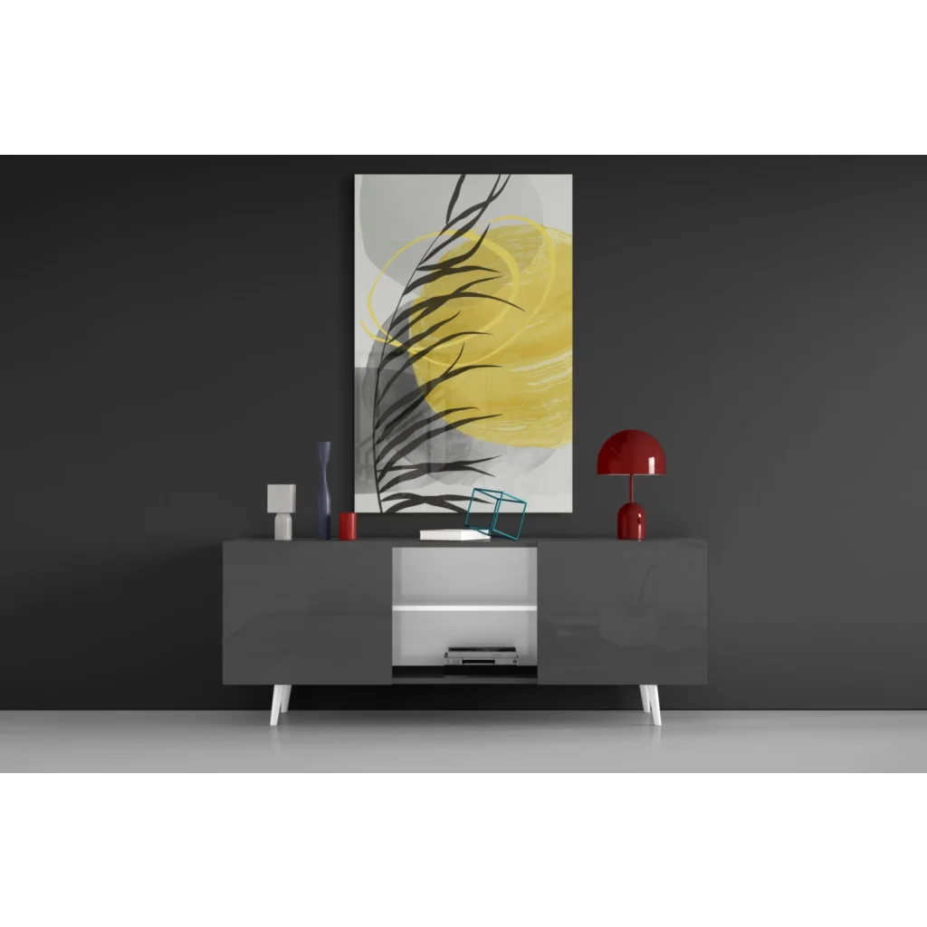 Bold black leaf silhouettes on vibrant yellow glass wall art