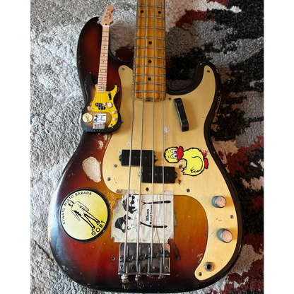 Mini 3-color sunburst Axe Heaven Fender Precision Bass with yellow pickguard, stickers, and adjustable A-frame stand