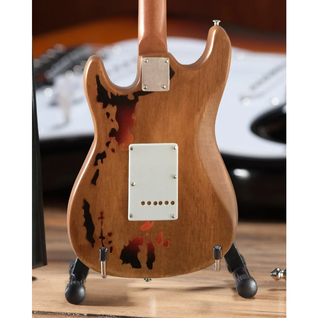 Axe Heaven Fender Strat miniature guitar collectible with natural wood, black pickguard, red pickup