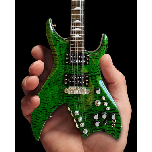 Green Axe Heaven miniature guitar replica with star body and stand