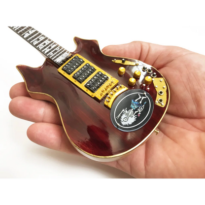 Red and gold Axe Heaven® guitar mini replica on adjustable A-frame stand