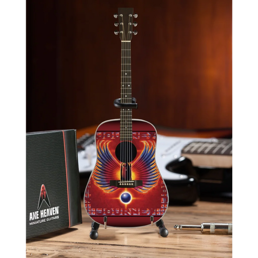 Axe Heaven Journey Phoenix Wings mini guitar with vibrant red orange wings on adjustable A-frame stand