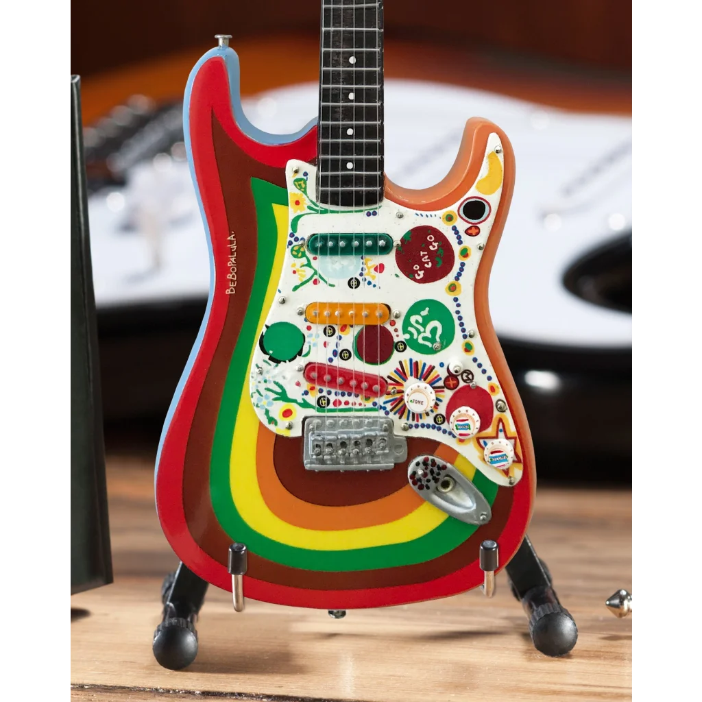 Axe Heaven mini guitar in rainbow colors with stickers and adjustable A-frame stand