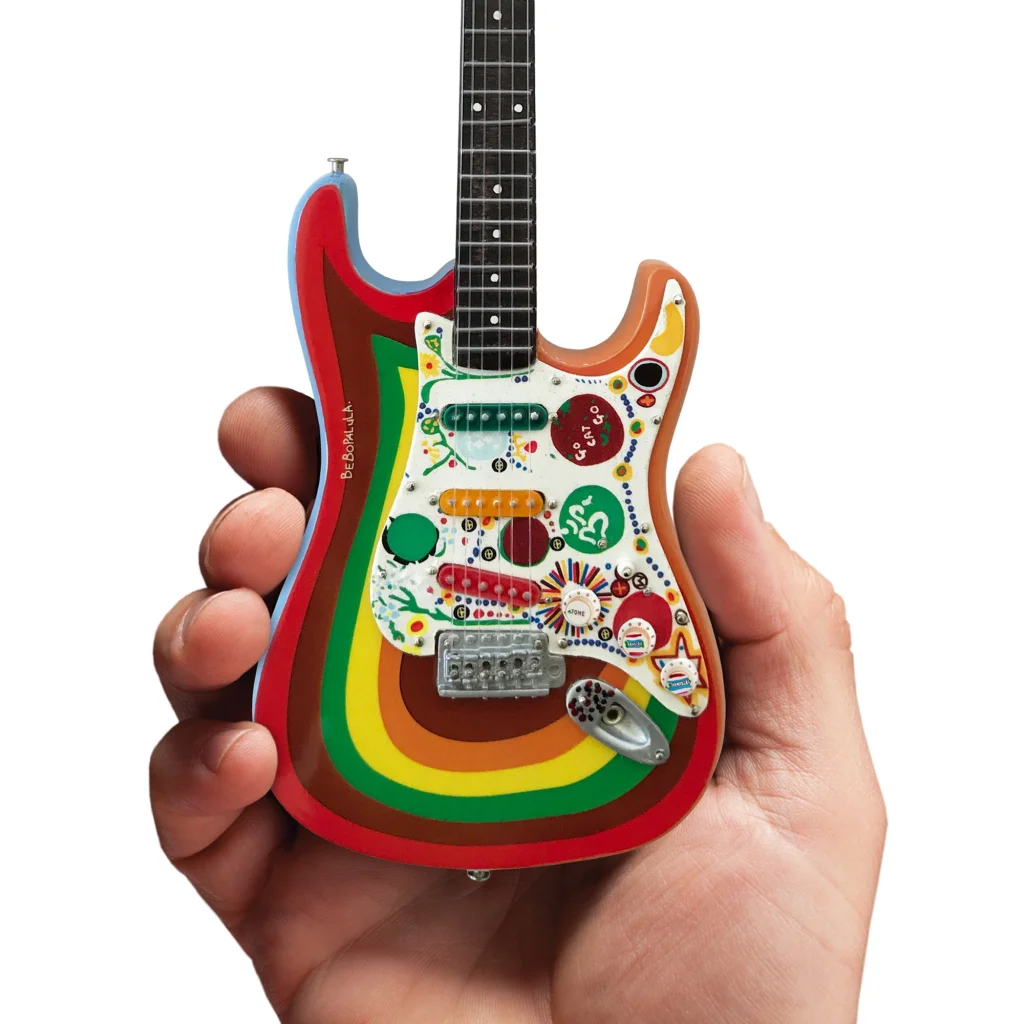 Axe Heaven mini guitar in rainbow colors with stand