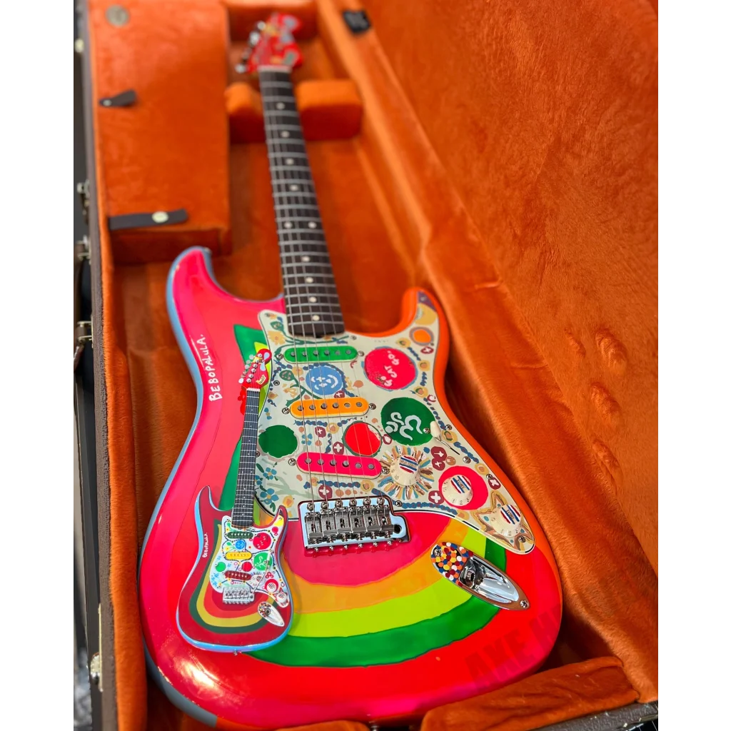 Axe Heaven mini guitar Rocky Strat in pink with decals and adjustable A-frame stand