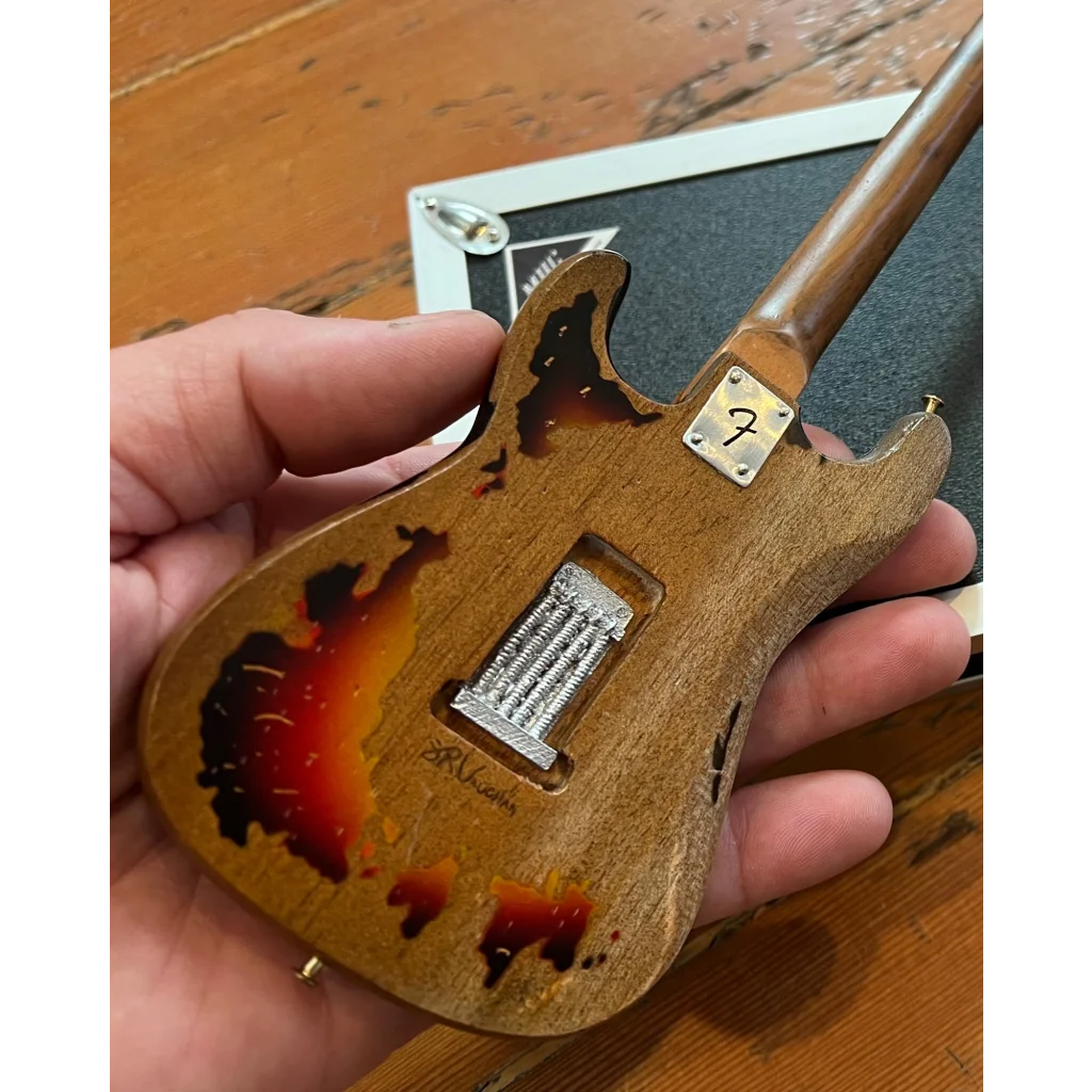 Axe Heaven mini guitar SRV Number One replica with tortoiseshell body and adjustable A-frame stand