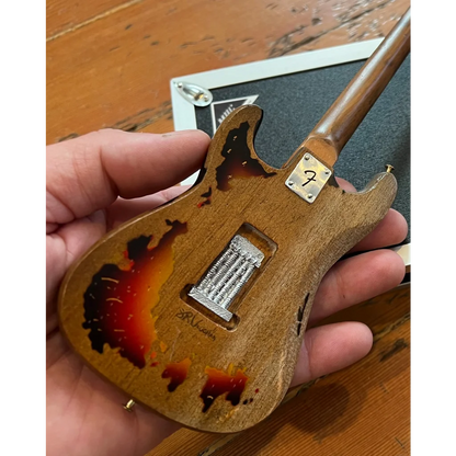 Axe Heaven mini guitar SRV Number One replica with tortoiseshell body and adjustable A-frame stand