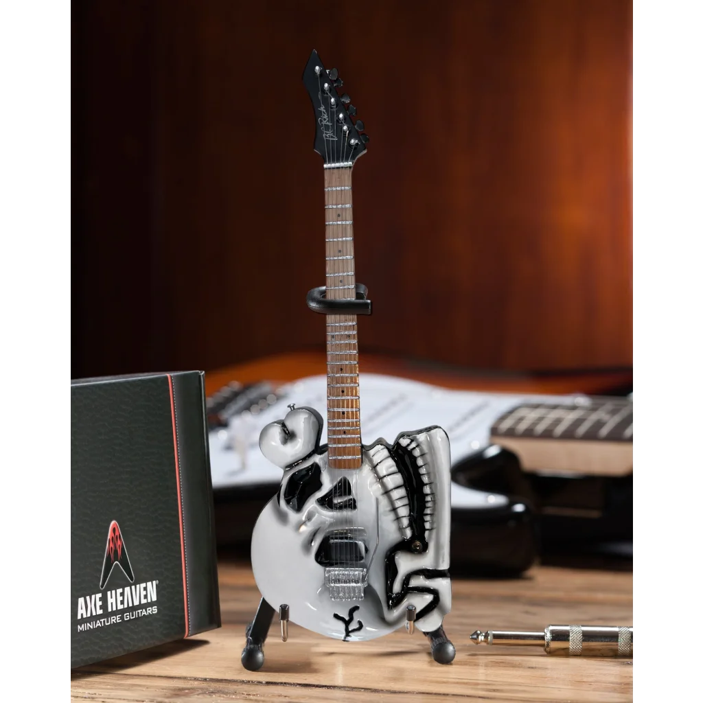 Axe Heaven miniature guitar replica with skull design on adjustable A-frame stand