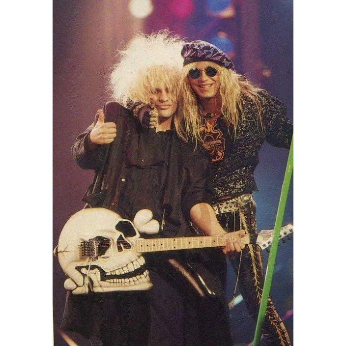 Axe Heaven skull-themed miniature guitar replica with adjustable A-frame stand