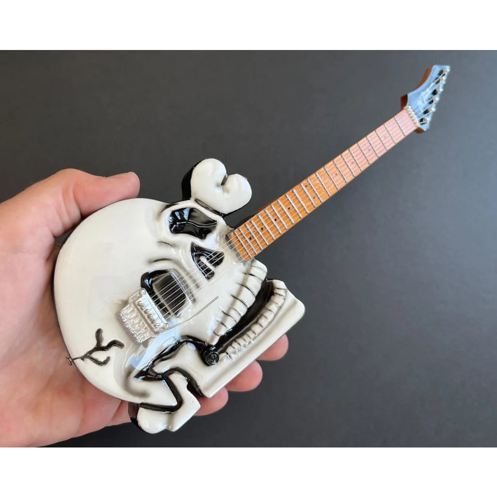 White Axe Heaven® skull guitar miniature replica on adjustable A-frame stand