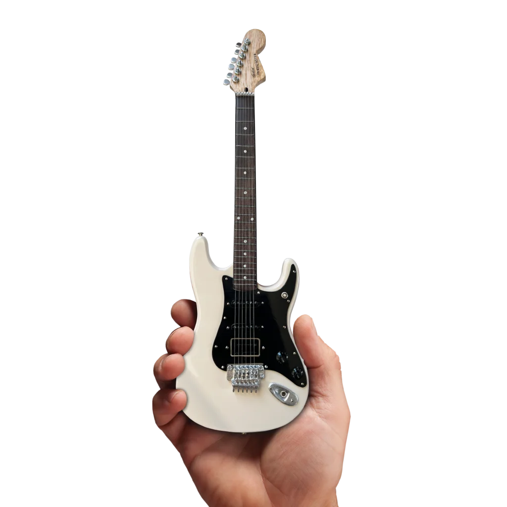 Miniature white Axe Heaven Officially Licensed Rush guitar with stand