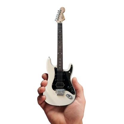 Miniature white Axe Heaven Officially Licensed Rush guitar with stand