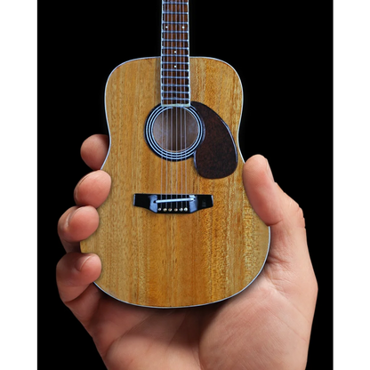 Axe Heaven® miniature guitar replica in hand with stand