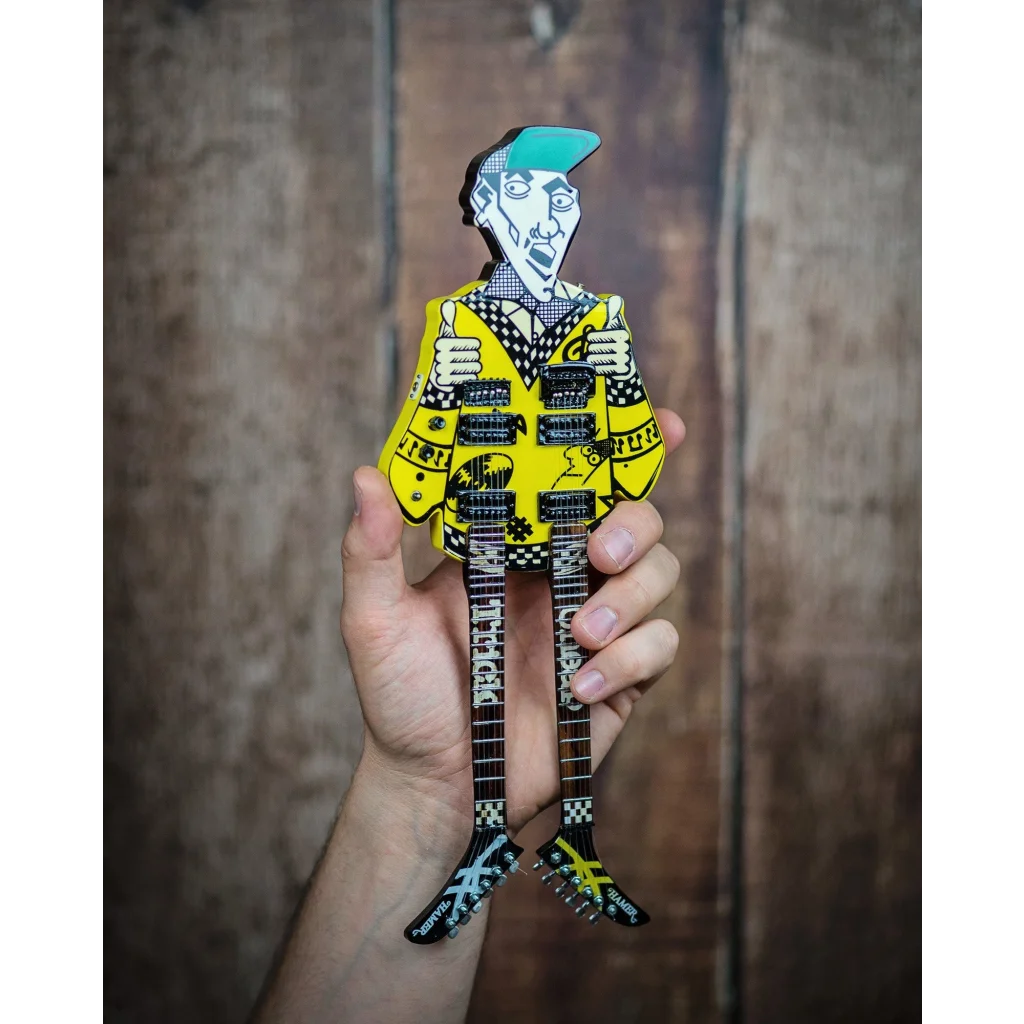 Axe Heaven® officially licensed miniature yellow black paper doll with blue hair