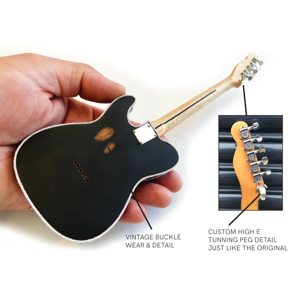 Axe Heaven Waylon Jennings floral Telecaster mini guitar replica with black finish and vintage buckle wear