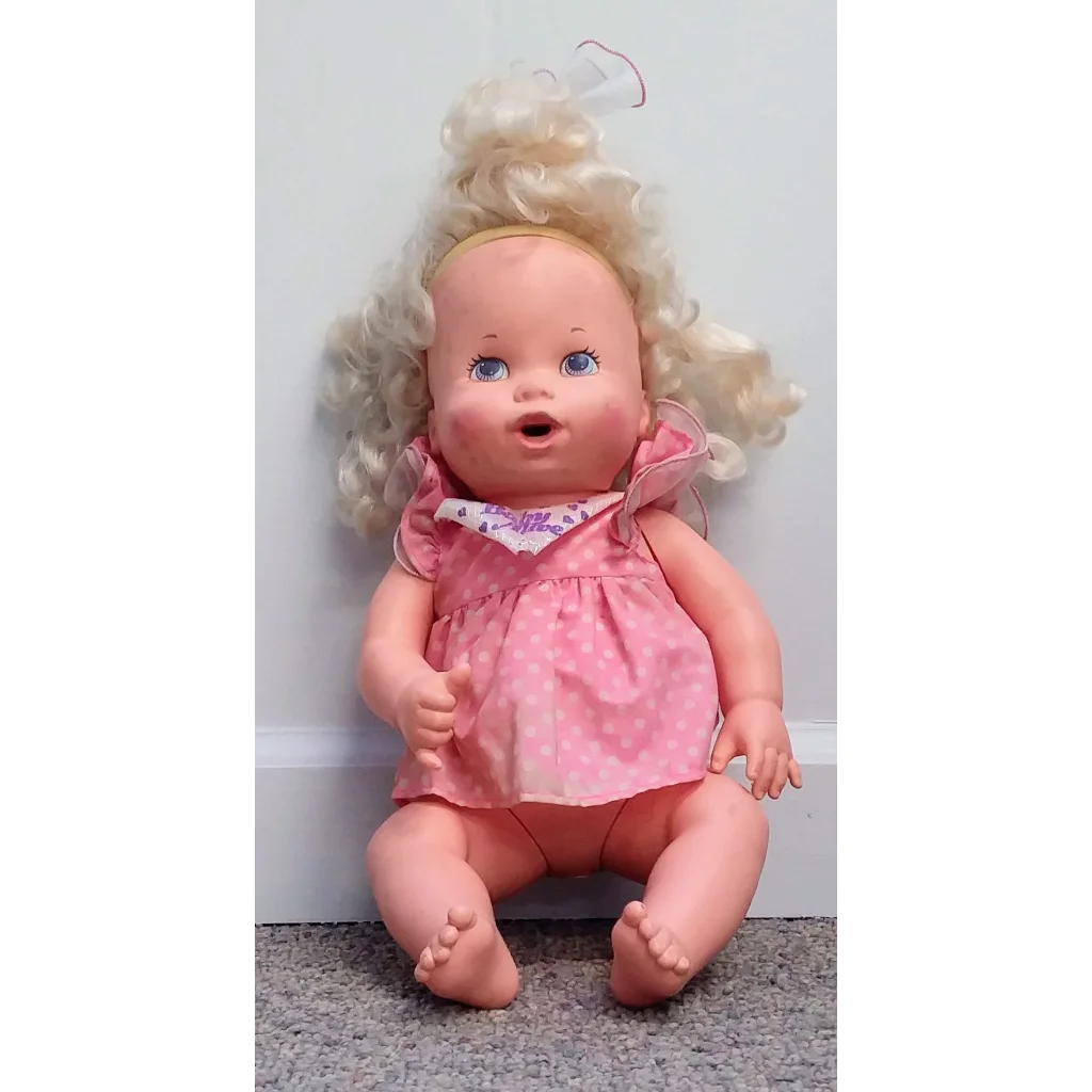Vintage blonde Baby Alive doll in pink polka dot dress