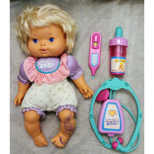 2015 baby check up doll with blonde hair, blue eyes, purple outfit