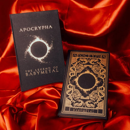 Black hardcover babymetal deluxe edition book with gold embossed title and eclipse design by gmb chomichuk 9x15