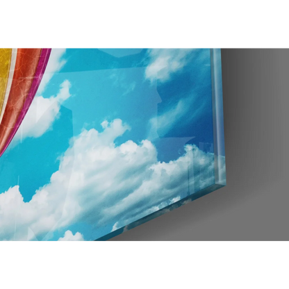 Rainbow hot air balloon glass wall art with blue sky and clouds