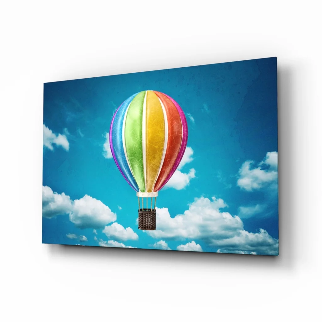 Vibrant rainbow hot air balloon wall art print in blue sky