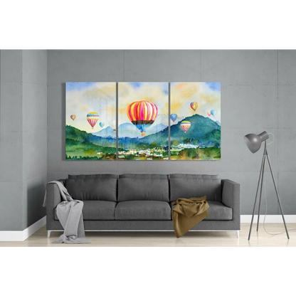 Vibrant hot air balloon triptych wall art above gray sofa