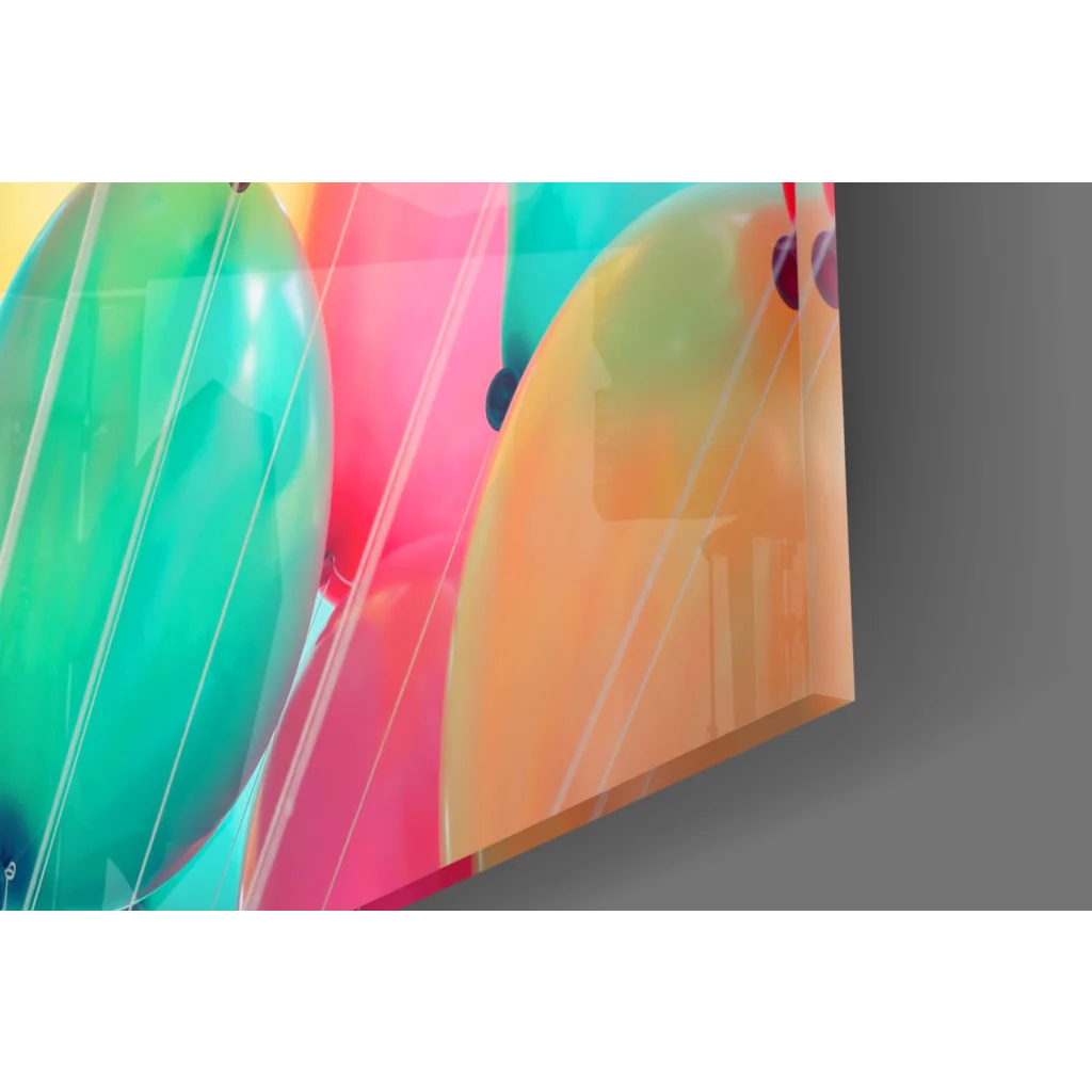 Vibrant glossy balloon burst glass wall art in green pink orange hues
