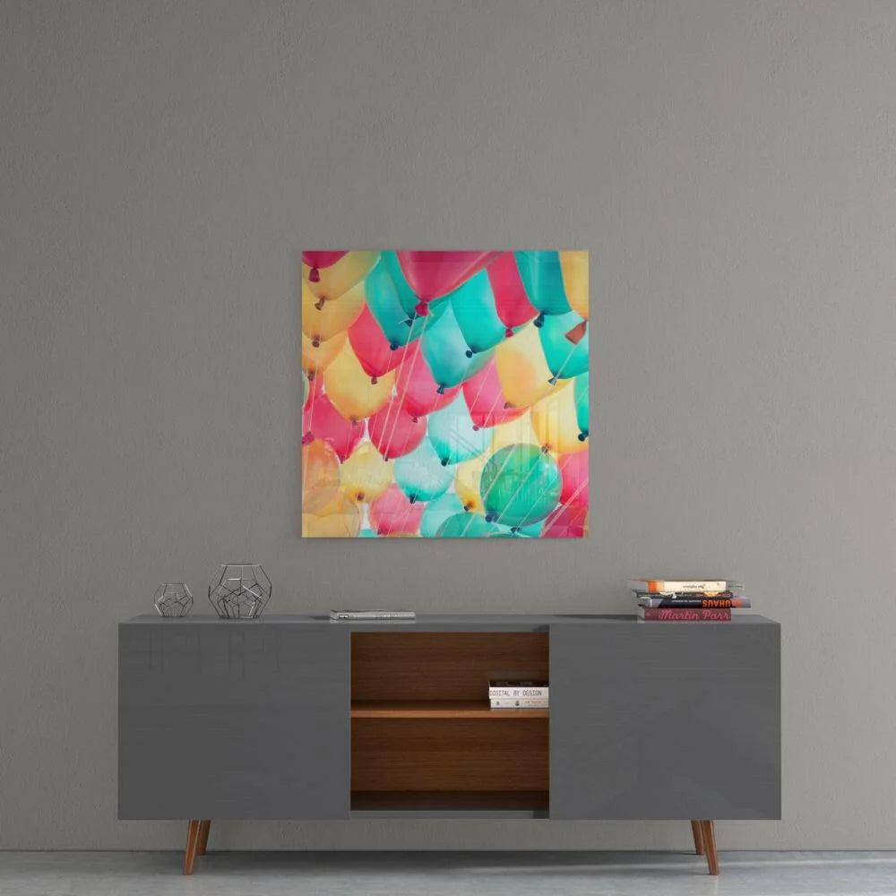 Vibrant colorful balloon glass wall art print with pink teal yellow green pattern