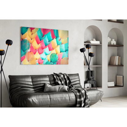 Vibrant multicolored balloon burst wall art canvas print on white wall
